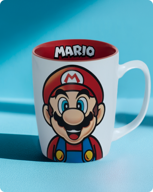 Mug with Mario character design on a blue background - click to shop SUPER NINTENDO WORLD™ Drinkware now!