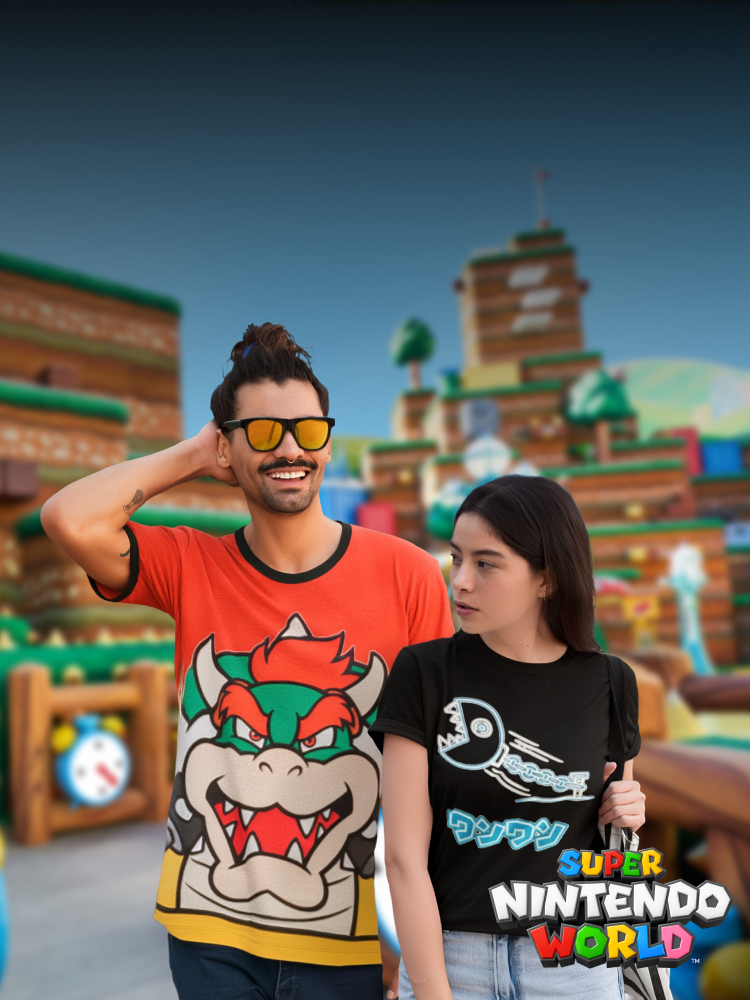 Image of two people at SUPER NINTENDO WORLD™, showcasing T-Shirts available on the Universal Shop - click to shop SUPER NINTENDO WORLD™ Merch now!