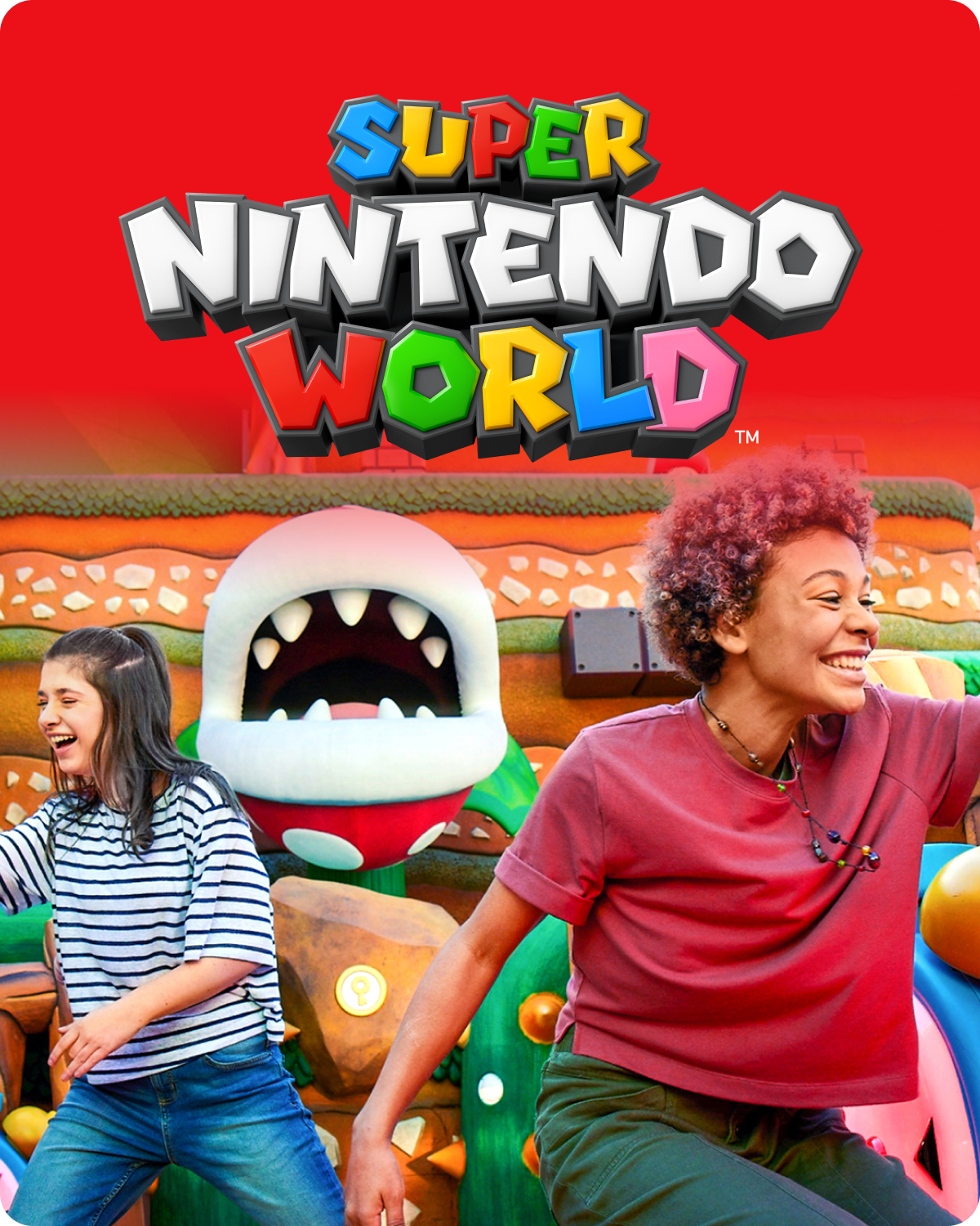 Two people standing in front of a colorful Piranha Plant with 'Super Nintendo World™' logo above - click to shop Super Nintendo World™ now!